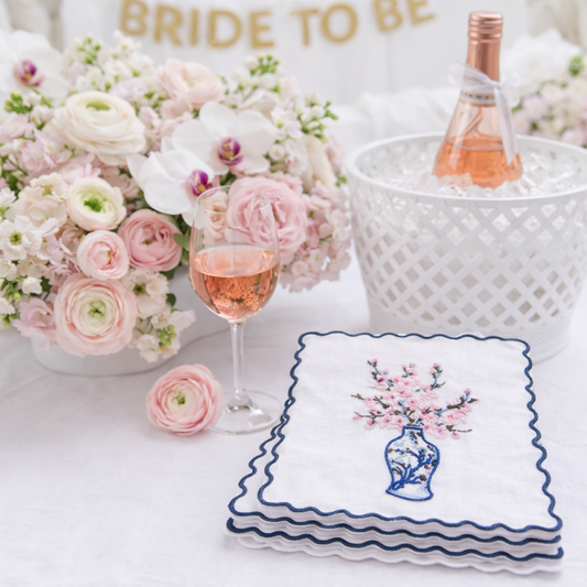 a bouquet of flowers and a glass of wine