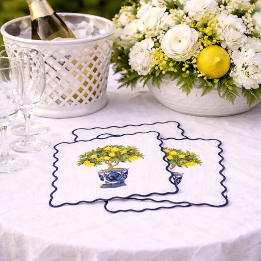a table with a white tablecloth and a basket of flowers