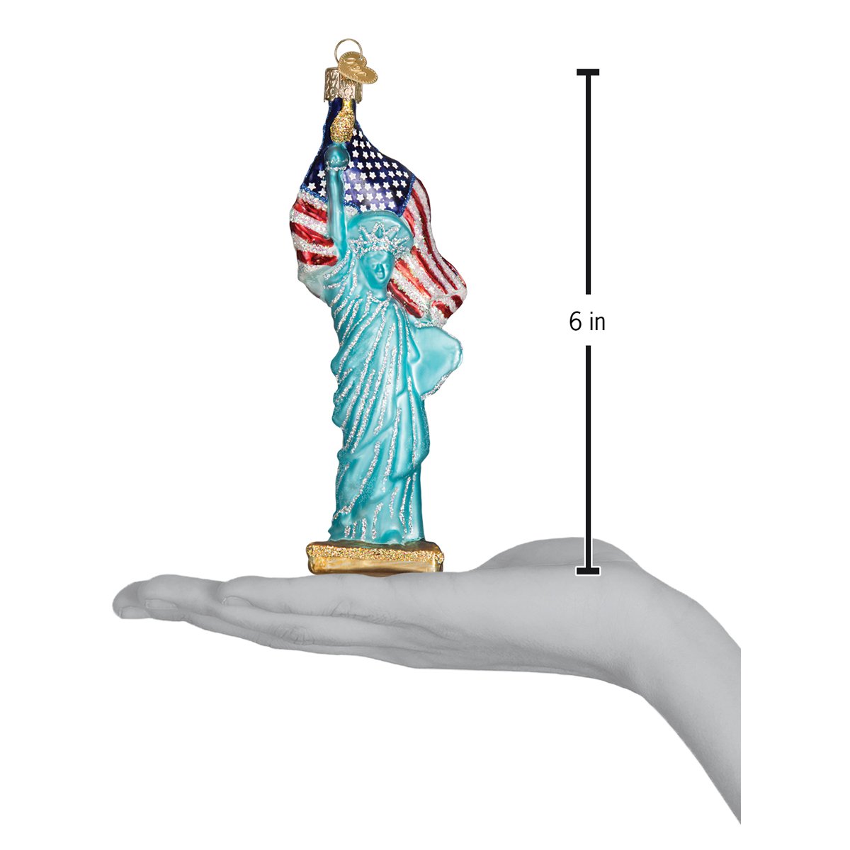 a hand holding a statue of liberty