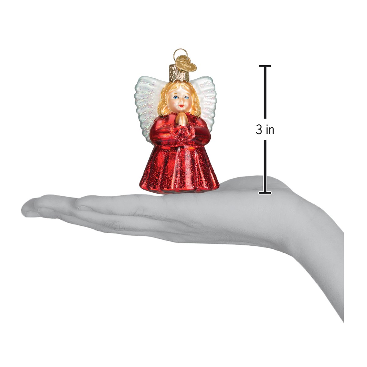 a hand holding a small angel ornament