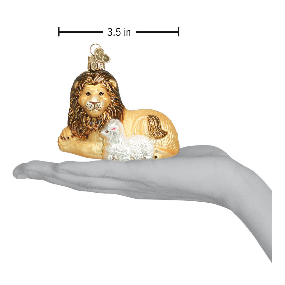 a hand holding a christmas ornament