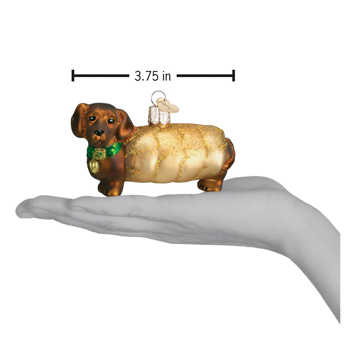 a hand holding a christmas ornament