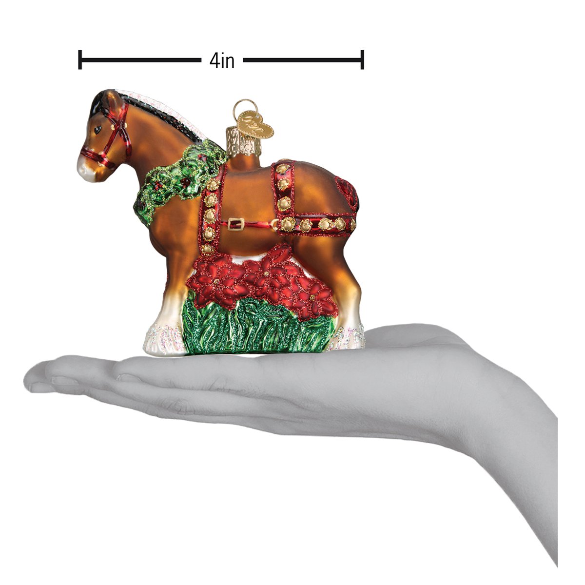 a hand holding a christmas ornament