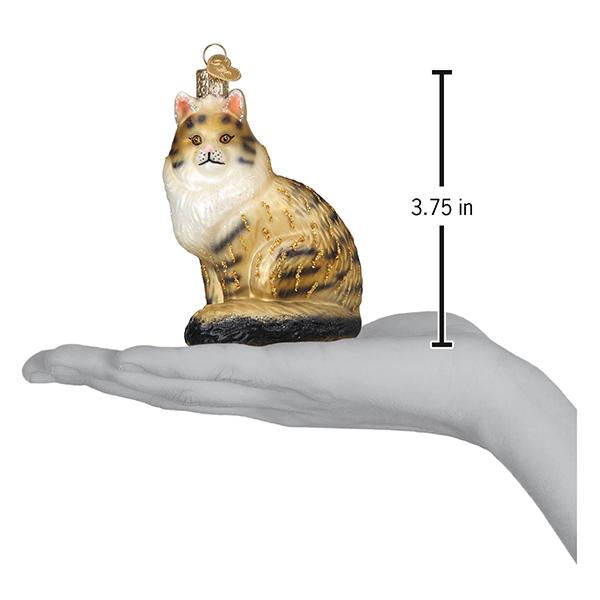 a hand holding a cat ornament