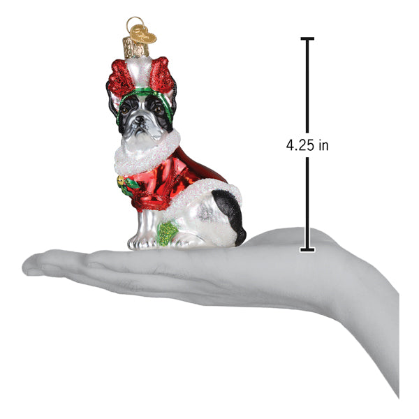 a hand holding a christmas ornament