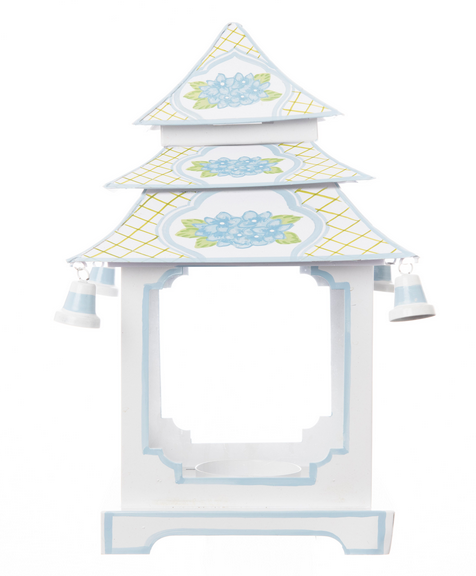 a white and blue paper object with bells