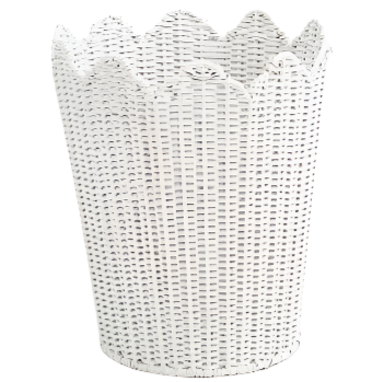 a white basket with a scalloped edge