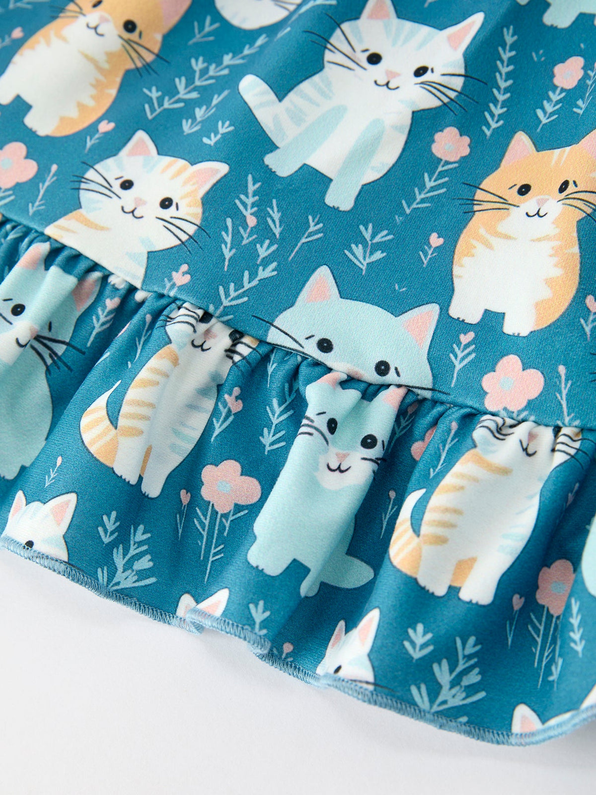 a blue fabric with cats on it