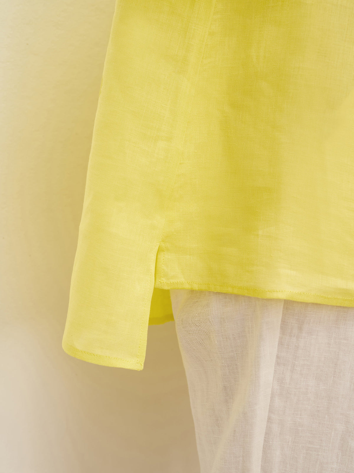 a yellow shirt with white fabric