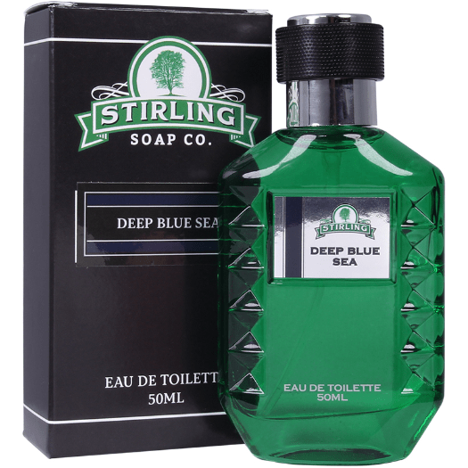 a bottle of perfume next to a box