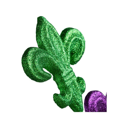 a green and purple fleur-de-lis