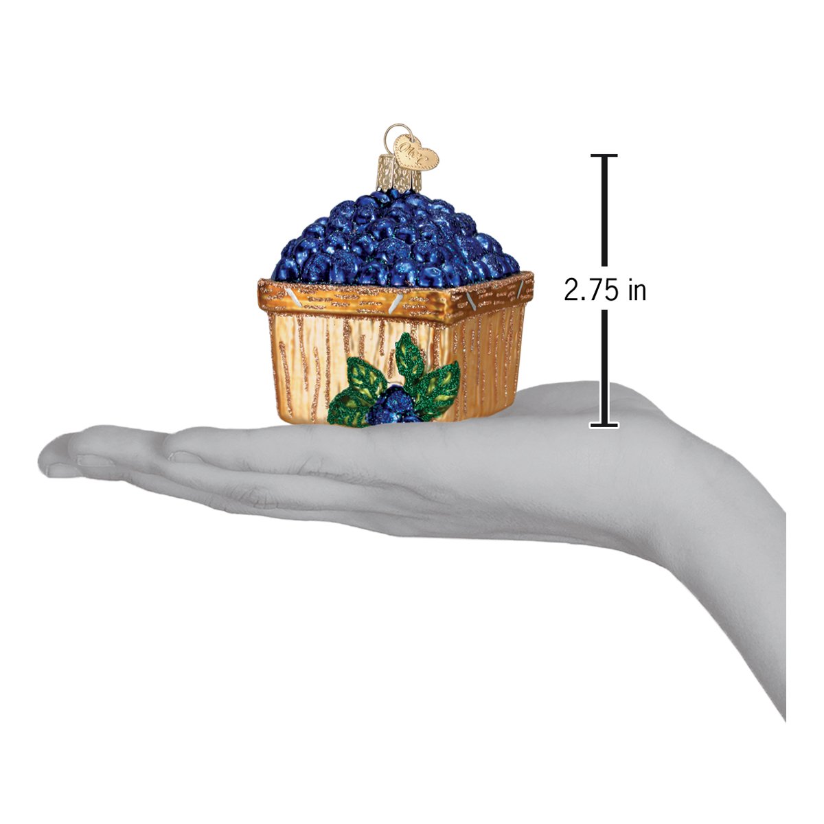 a hand holding a blue berry ornament