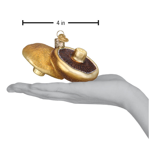 a hand holding a pair of mushrooms ornaments