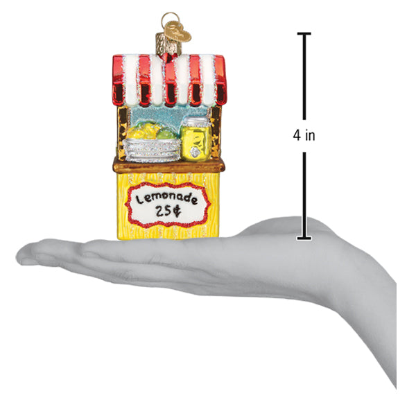 a hand holding a lemonade stand ornament