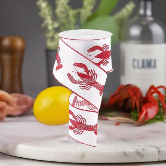a roll of red and white ribbon with lobsters on it