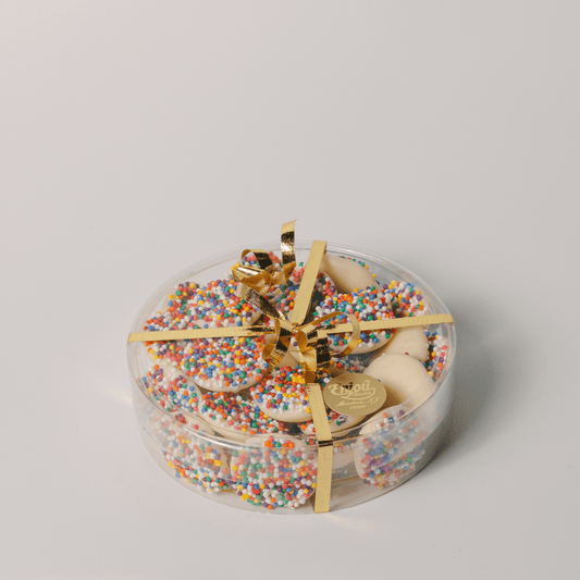 a round container with colorful sprinkles