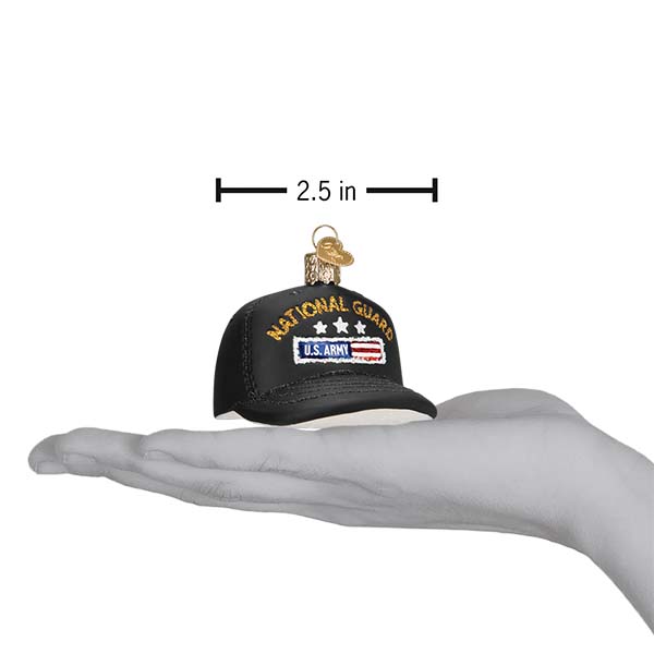 a hand holding a small hat