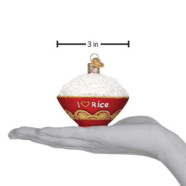 a hand holding a christmas ornament
