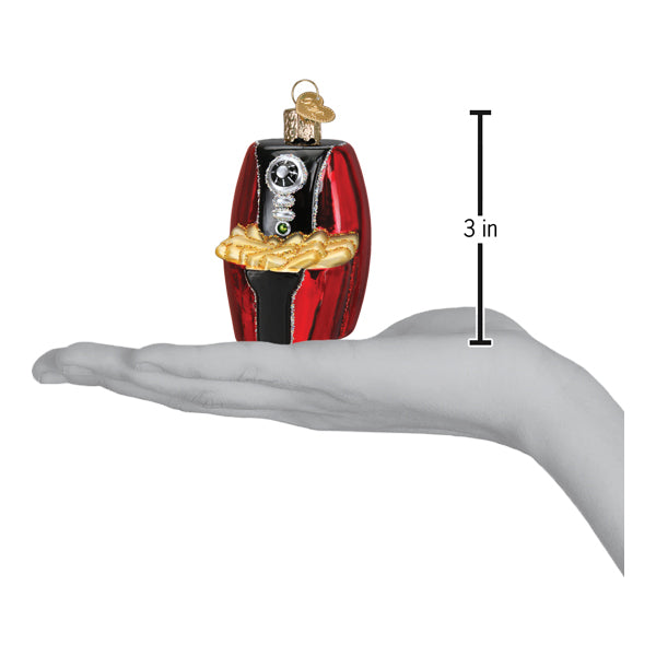 a hand holding a christmas ornament