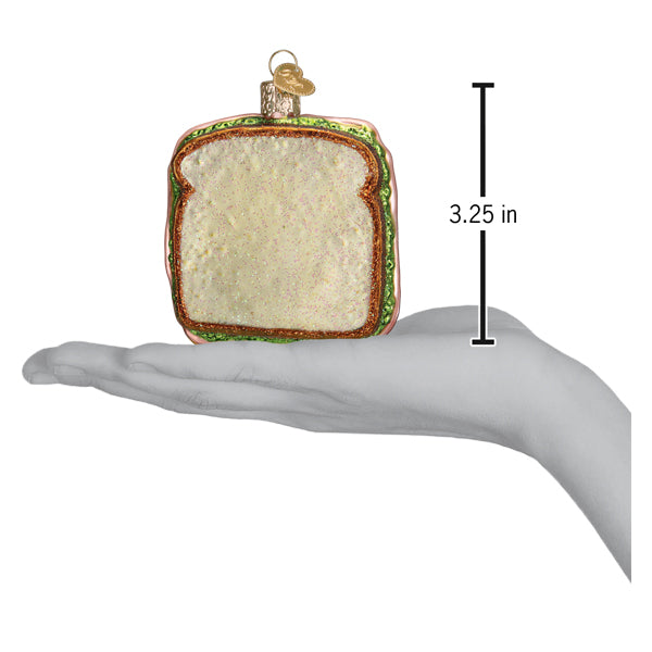 a hand holding a piece of bread
