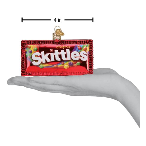 a hand holding a candy ornament