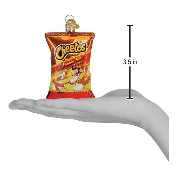 a hand holding a small bag of chips