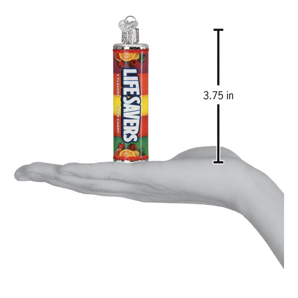 a hand holding a tube of candy