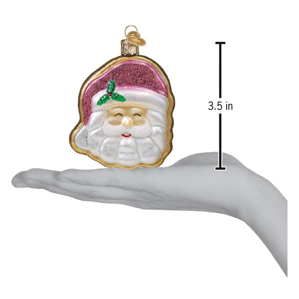 a hand holding a christmas ornament