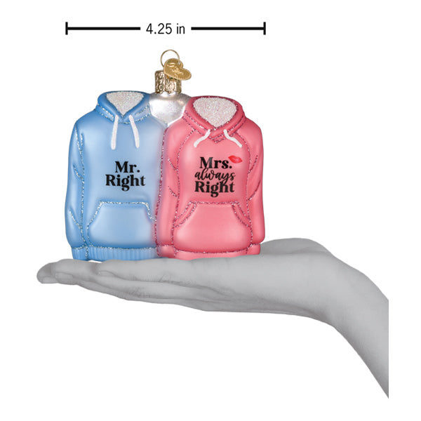 a hand holding a christmas ornament