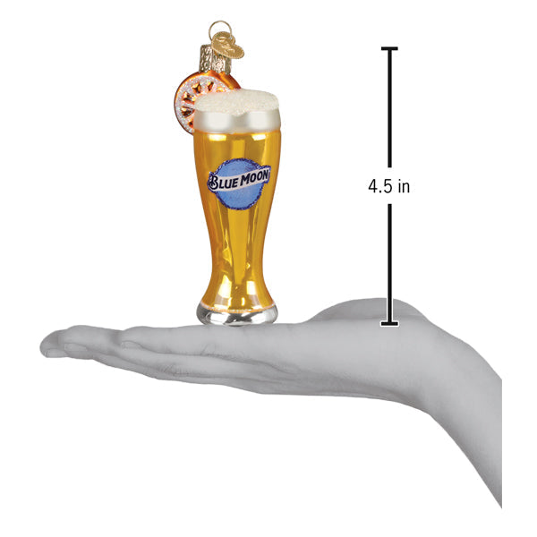 a hand holding a glass of beer