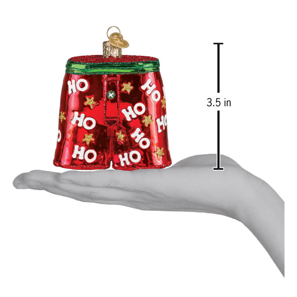 a hand holding a christmas ornament
