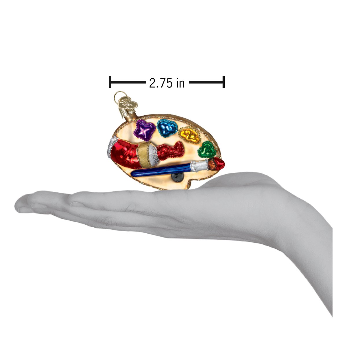 a hand holding a christmas ornament