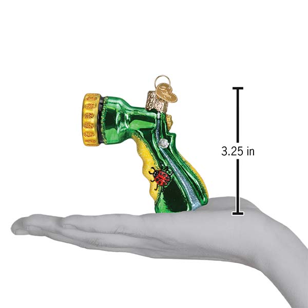 a hand holding a christmas ornament