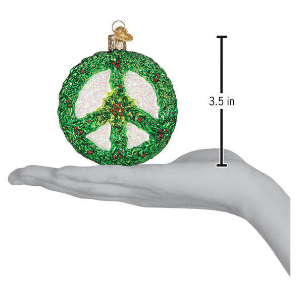 a hand holding a peace sign ornament