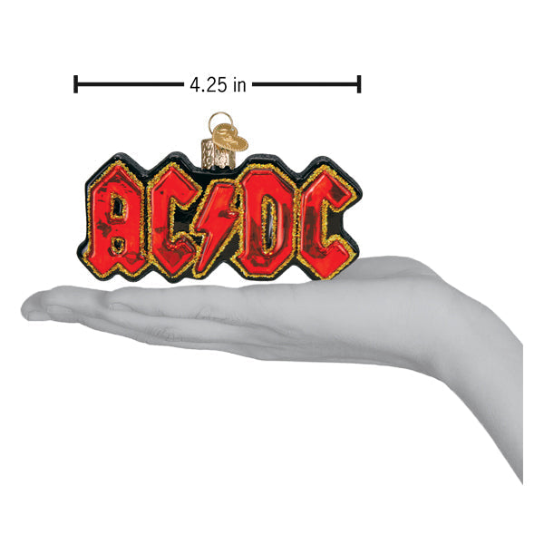 a hand holding a christmas ornament