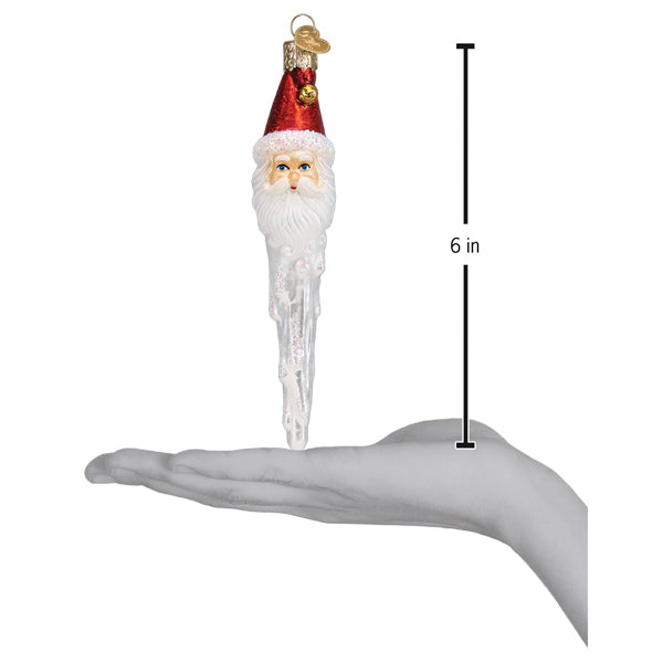 a hand holding a christmas ornament