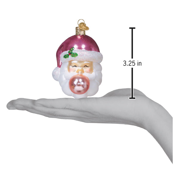 a hand holding a christmas ornament