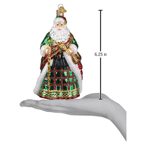 a hand holding a christmas ornament