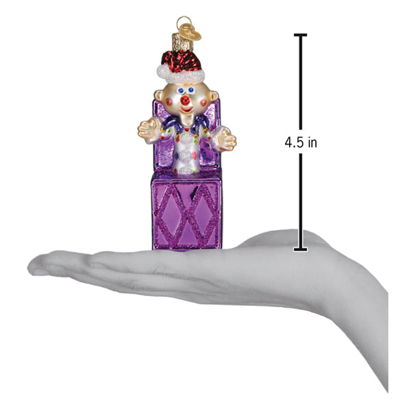a hand holding a purple toy