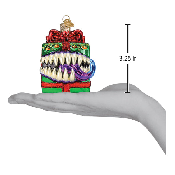 a hand holding a christmas ornament