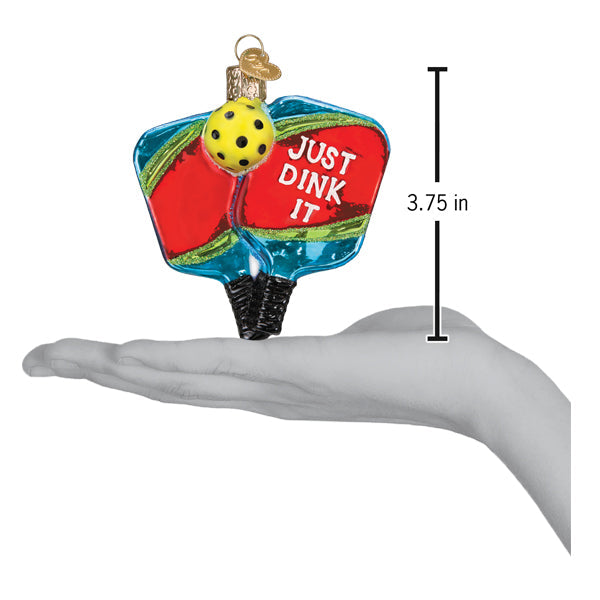 a hand holding a christmas ornament