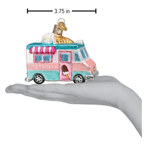a hand holding a toy ice cream truck
