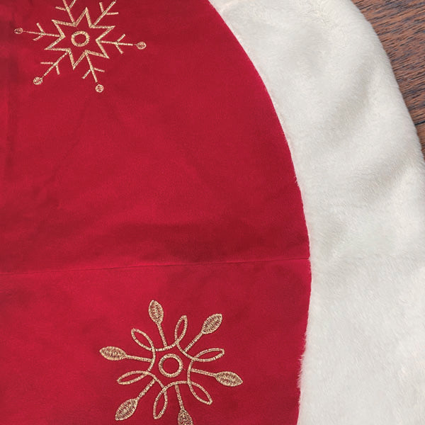 a red and white christmas tree skirt