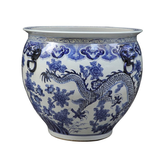 a blue and white vase with a dragon design