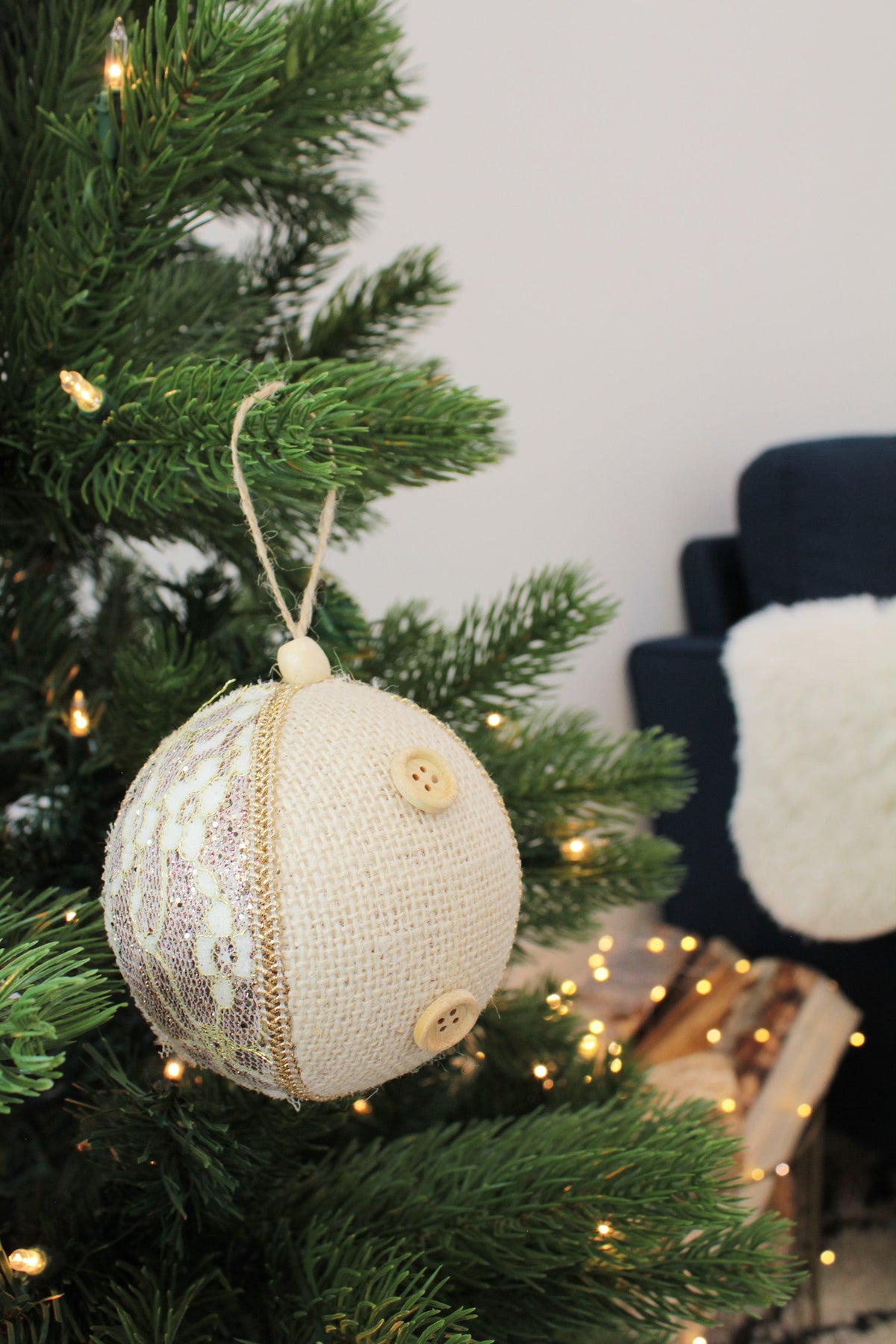 a christmas tree with a white and gold ornament