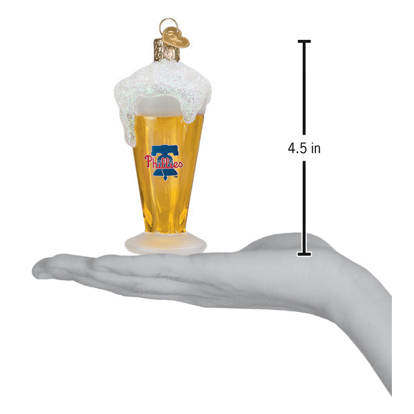 a hand holding a glass of beer