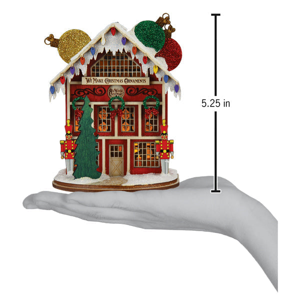 a hand holding a small house