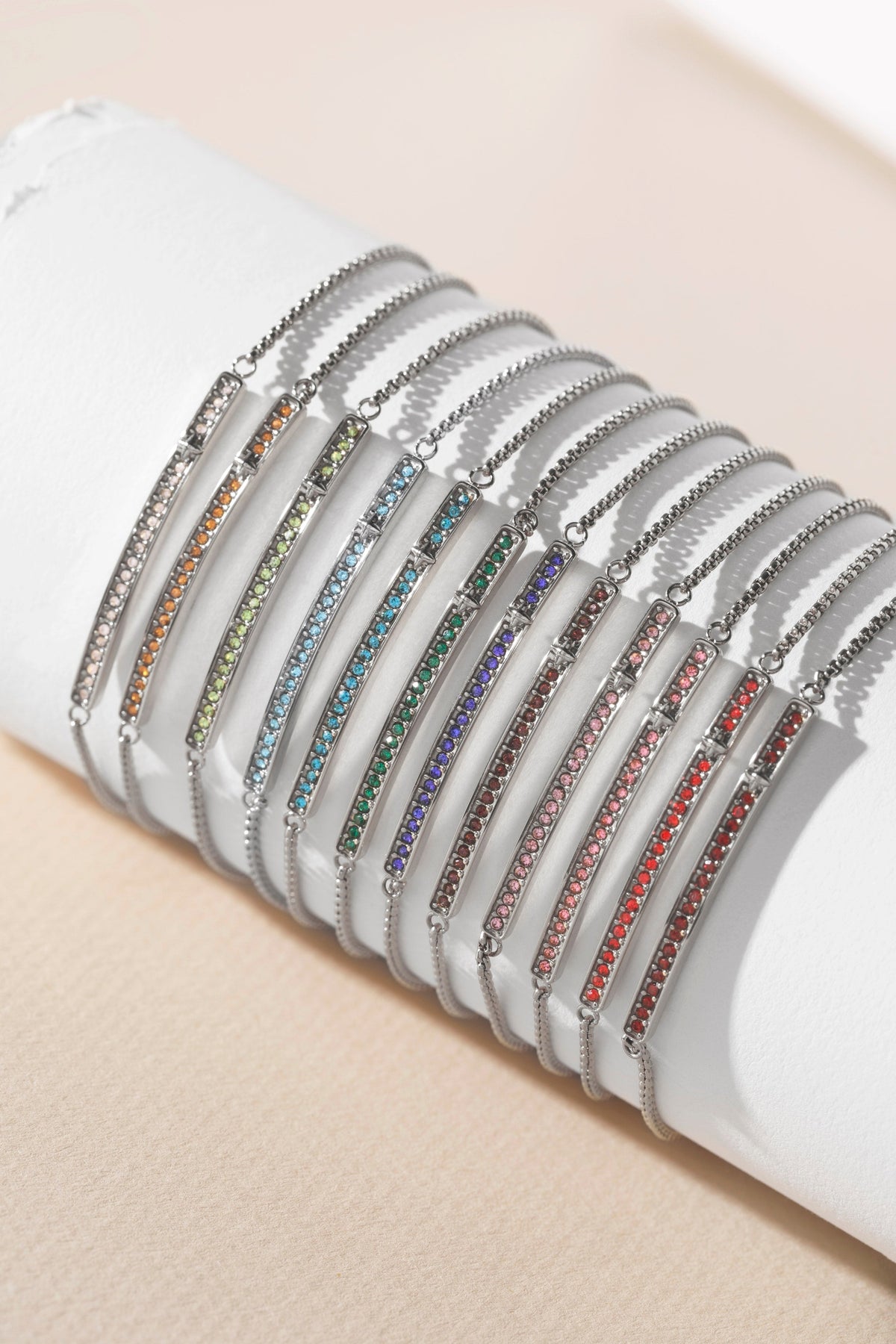 a group of bracelets on a white surface