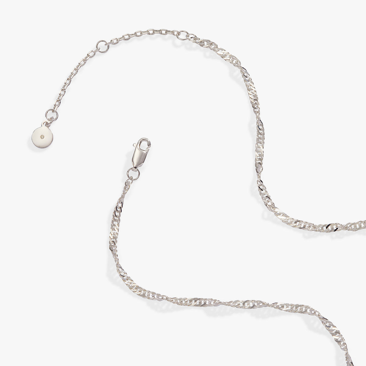 a silver chain with a pearl on it