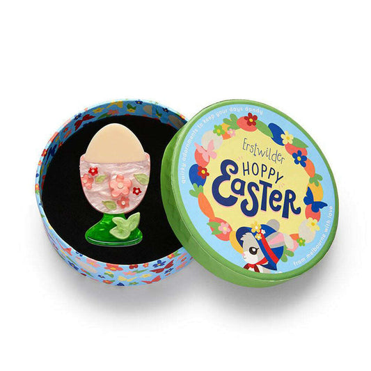 a round box with a small object in it